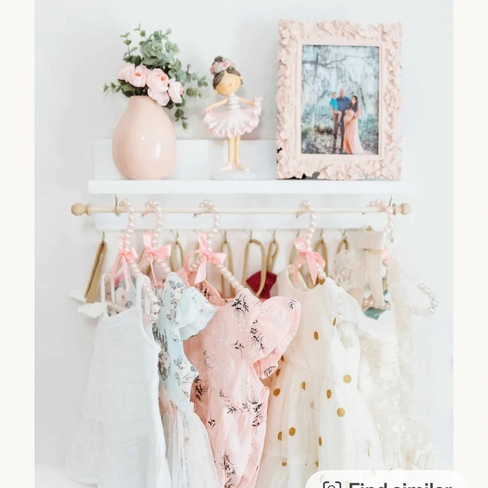 Adorable Nursery bow and clothing rod and shelf for baby girl rooms!